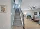 Staircase leading to the upper level, complemented by stylish decor at 14883 Golden Sunburst Ave, Orlando, FL 32827