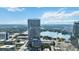 Panoramic aerial view showing the high-rise and lake, nestled in a vibrant city with stunning surroundings at 150 E Robinson St # 801, Orlando, FL 32801