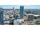 Expansive aerial view of the cityscape highlighting the high-rise building, pool, and surrounding urban landscape at 150 E Robinson St # 801, Orlando, FL 32801