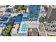 Aerial shot showcasing a rooftop pool and tennis court, adding a resort-like feel to urban living at 150 E Robinson St # 801, Orlando, FL 32801