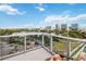 Spacious balcony offering a breathtaking view of the lake, cityscape, and lush park at 150 E Robinson St # 801, Orlando, FL 32801