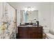 Elegant bathroom featuring a dark wood vanity with marble countertop and stylish lighting at 150 E Robinson St # 801, Orlando, FL 32801
