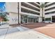 Inviting entrance to the Vue at Lake Eola, featuring well-maintained landscaping and brick-paved drive at 150 E Robinson St # 801, Orlando, FL 32801