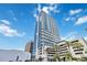 Modern high-rise building with sleek architecture and beautiful sky views in a vibrant city setting at 150 E Robinson St # 801, Orlando, FL 32801