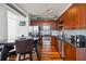 Contemporary kitchen features stainless steel appliances, sleek cabinets, and a breakfast bar with table at 150 E Robinson St # 801, Orlando, FL 32801