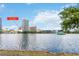 Picturesque view of 150 E Robinson Street, #801, situated across from a tranquil lake at 150 E Robinson St # 801, Orlando, FL 32801