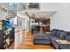 Open-concept living room boasts a modern kitchen, spiral staircase, hardwood floors and expansive city views at 150 E Robinson St # 801, Orlando, FL 32801