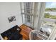 Upstairs view of the living room featuring hardwood floors, sectional couch and city views at 150 E Robinson St # 801, Orlando, FL 32801