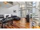 Bright living room features hardwood floors, high ceilings, large windows, city views and a spiral staircase at 150 E Robinson St # 801, Orlando, FL 32801