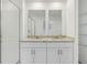 Bright bathroom featuring double vanity with granite countertop at 16419 Bird Of Paradise Ave, Clermont, FL 34714