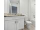 Bathroom featuring granite countertop vanity and tiled floor at 16419 Bird Of Paradise Ave, Clermont, FL 34714