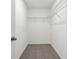 Walk-in closet featuring carpeted floor and shelving at 16419 Bird Of Paradise Ave, Clermont, FL 34714