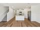 Open-concept kitchen features an island, stainless steel appliances, and modern cabinetry at 16419 Bird Of Paradise Ave, Clermont, FL 34714