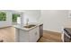 Modern kitchen island features granite countertops, stainless steel sink and dishwasher at 16419 Bird Of Paradise Ave, Clermont, FL 34714