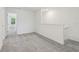 Upstairs loft area with neutral carpet and white walls at 16419 Bird Of Paradise Ave, Clermont, FL 34714