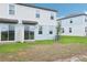 View of a backyard featuring a sliding glass door at 16430 Bird Of Paradise Ave, Clermont, FL 34714