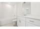 A well-lit bathroom features a shower and tub combination at 16430 Bird Of Paradise Ave, Clermont, FL 34714