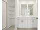 A bathroom with a large double sink and a stand up shower at 16430 Bird Of Paradise Ave, Clermont, FL 34714