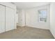 Bedroom with natural light, neutral carpeting, and closet at 16430 Bird Of Paradise Ave, Clermont, FL 34714