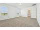 This bedroom has carpet floors and two windows bringing in natural light at 16430 Bird Of Paradise Ave, Clermont, FL 34714