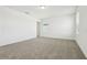 Spacious bedroom with carpeted floors and a view to the outside at 16430 Bird Of Paradise Ave, Clermont, FL 34714