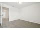 Bedroom with neutral carpeting, natural light and open doorway at 16430 Bird Of Paradise Ave, Clermont, FL 34714