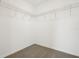 Walk-in closet with metal shelving at 16430 Bird Of Paradise Ave, Clermont, FL 34714