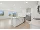 Bright kitchen features an island, stainless steel appliances, and tiled flooring at 16430 Bird Of Paradise Ave, Clermont, FL 34714