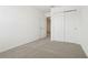 Bright bedroom features neutral carpet, white walls, and a closet at 16434 Bird Of Paradise Ave, Clermont, FL 34714