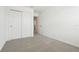Bright bedroom features neutral carpet, white walls, and a closet at 16434 Bird Of Paradise Ave, Clermont, FL 34714