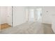 Spacious bedroom featuring neutral carpet and multiple access doors providing a versatile living space at 16434 Bird Of Paradise Ave, Clermont, FL 34714
