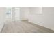 Carpeted hallway with natural light showcasing seamless access to different rooms of the property at 16434 Bird Of Paradise Ave, Clermont, FL 34714