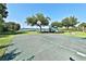 Outdoor basketball court offers recreational opportunities with a nearby playground and lake views at 2446 Sweetwater Country Club Dr, Apopka, FL 32712