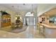 Elegant dining area featuring a chandelier, a china cabinet, and transom windows for natural light at 2446 Sweetwater Country Club Dr, Apopka, FL 32712