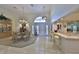 Elegant dining area featuring a chandelier, a china cabinet, and transom windows for natural light at 2446 Sweetwater Country Club Dr, Apopka, FL 32712