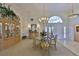 Bright dining room features stylish decor and an elegant chandelier, perfect for hosting dinners at 2446 Sweetwater Country Club Dr, Apopka, FL 32712