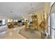 Bright, open living and dining space with tile entry and comfortable seating, ideal for entertaining and relaxing at 2446 Sweetwater Country Club Dr, Apopka, FL 32712