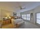 Serene main bedroom with a comfortable bed, neutral tones, and a window with plantation shutters at 2446 Sweetwater Country Club Dr, Apopka, FL 32712