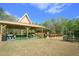 Lakeside picnic pavilion with picnic tables and grill, ideal for outdoor gatherings and enjoying scenic waterfront views at 2446 Sweetwater Country Club Dr, Apopka, FL 32712