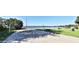 Enjoy a sand volleyball court by the lake, perfect for outdoor recreation and leisure at 2446 Sweetwater Country Club Dr, Apopka, FL 32712