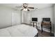 Bright bedroom features a metal frame bed, ceiling fan and ample storage at 360 Coventry Estate Blvd, Deltona, FL 32725