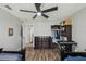 Comfortable bedroom with wooden floor, ceiling fan, and a walk-in closet at 360 Coventry Estate Blvd, Deltona, FL 32725