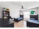 Bedroom with matching beds, a dark wood desk and modern fan at 360 Coventry Estate Blvd, Deltona, FL 32725