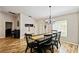 Traditional dining room featuring a wooden table with seating for six and a stylish chandelier at 360 Coventry Estate Blvd, Deltona, FL 32725