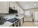 Bright kitchen featuring stainless steel appliances, sleek white countertops and subway tile backsplash at 360 Coventry Estate Blvd, Deltona, FL 32725