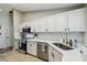 Bright kitchen featuring stainless steel appliances, sleek white countertops and subway tile backsplash at 360 Coventry Estate Blvd, Deltona, FL 32725