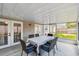 Screened patio with a table and chairs, perfect for outdoor entertaining at 360 Coventry Estate Blvd, Deltona, FL 32725