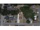 Aerial view of property with rough estimates of the lot lines in a neighborhood with mature trees at 607 Ross St, Leesburg, FL 34748