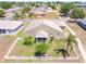 Aerial view of house with nice landscaping, backyard with white fence and lawn at 829 Terranova Rd, Winter Haven, FL 33884