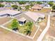 Exterior aerial of home features lush lawn, white fence, screened-in lanai at 829 Terranova Rd, Winter Haven, FL 33884